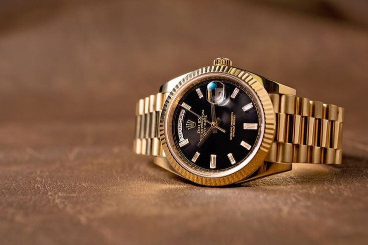 Rolex Oyster Perpetual Day-Date Black Dial.